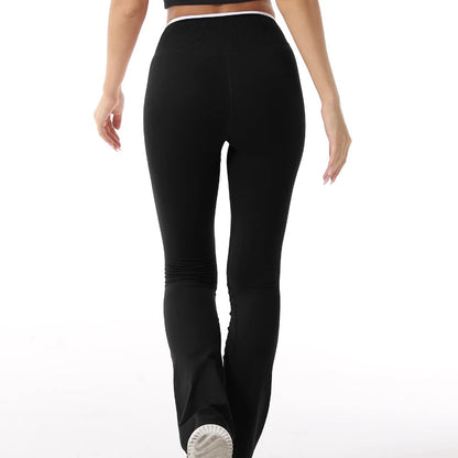 Sculvea push-up flare leggings - black - back view, walking