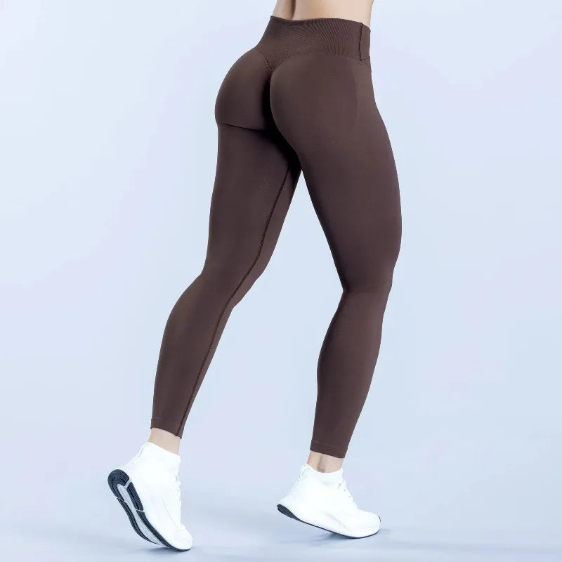 Sculvea seamless push-up yoga leggings - brown - back view, walking